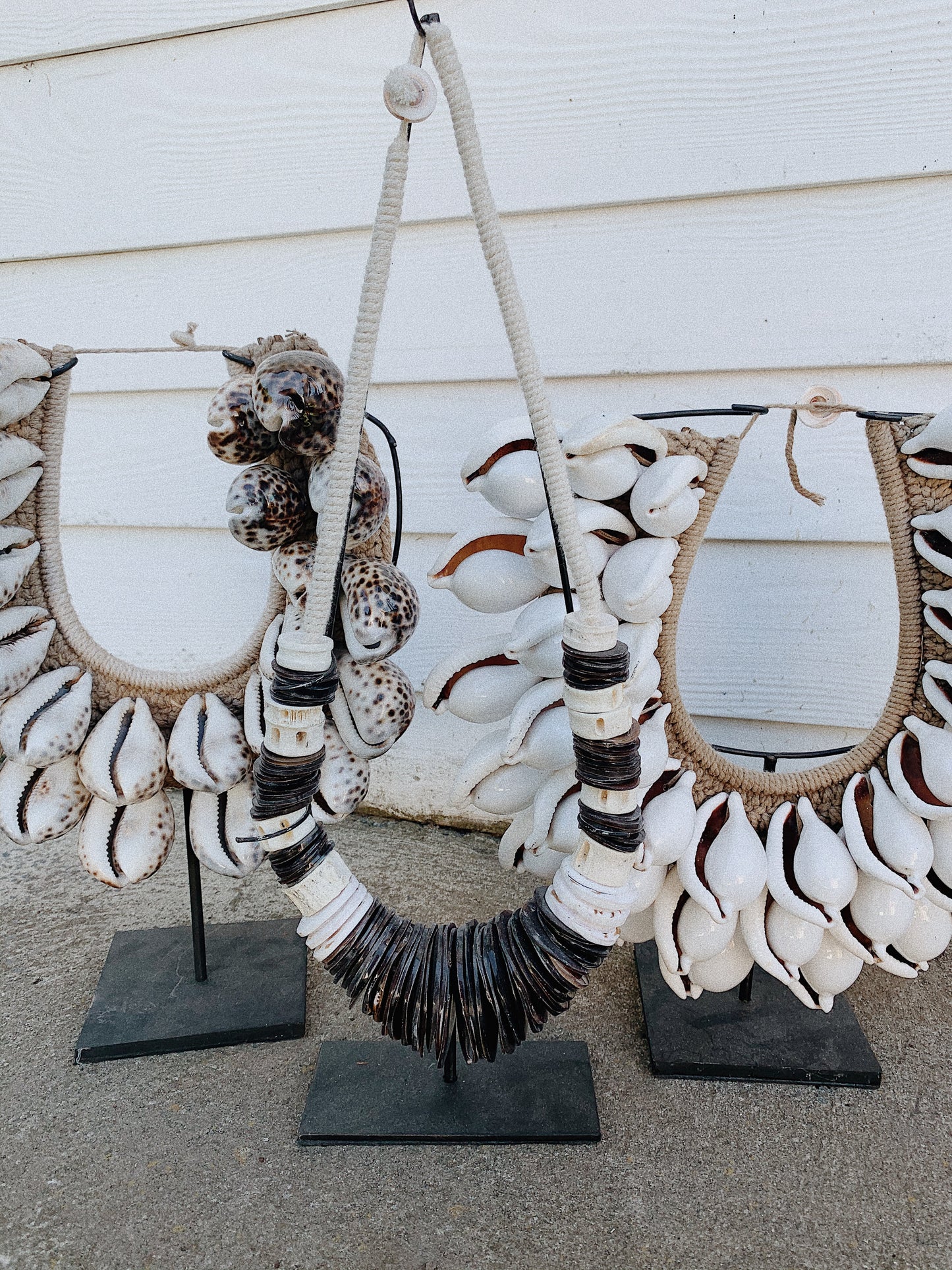 BLACK AND WHITE TRIBAL PEACE NECKLACE ON STAND