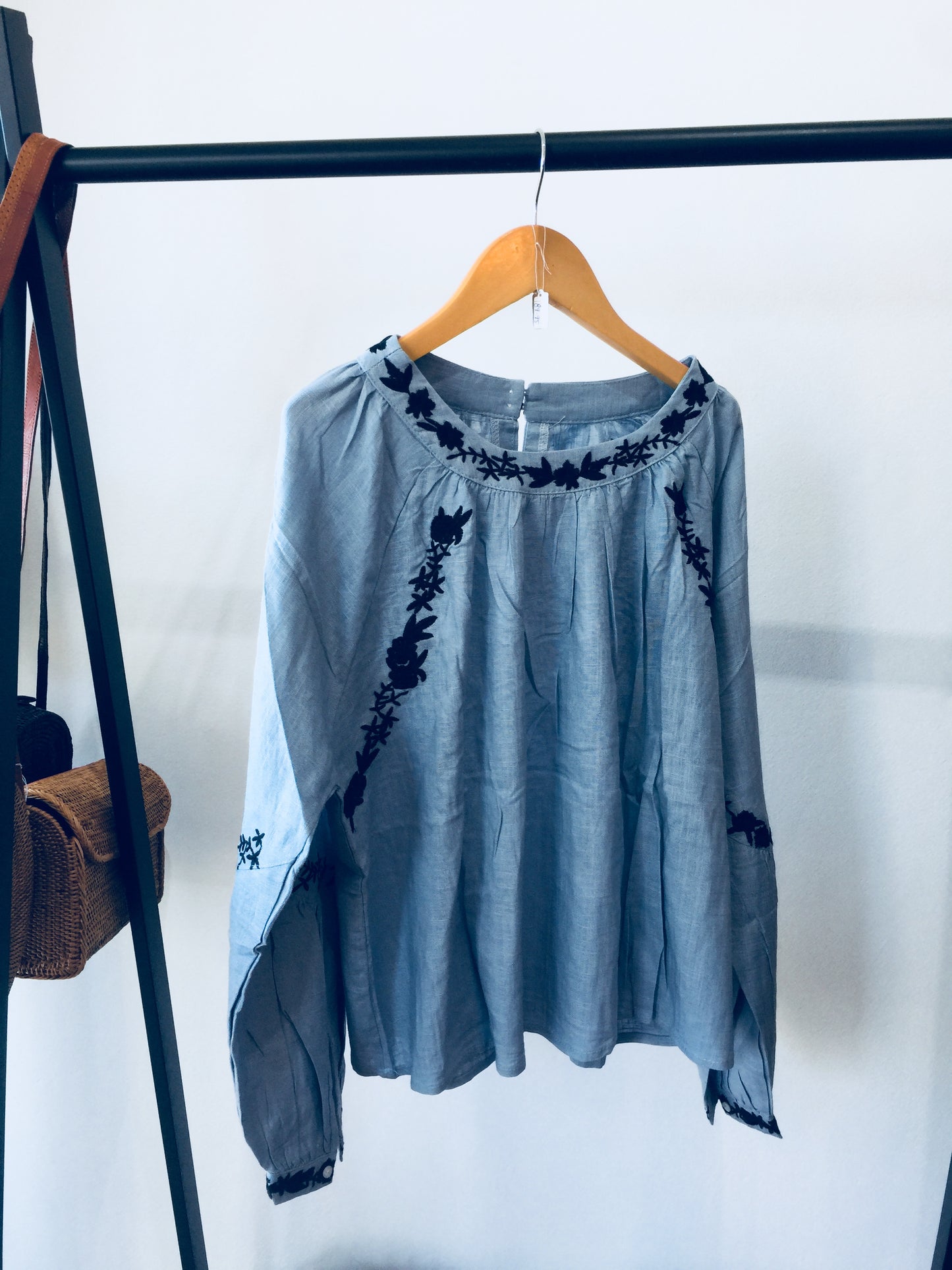 Light Wash Blue Linen Shirt With Black Floral Hand Embroidered Detail.
