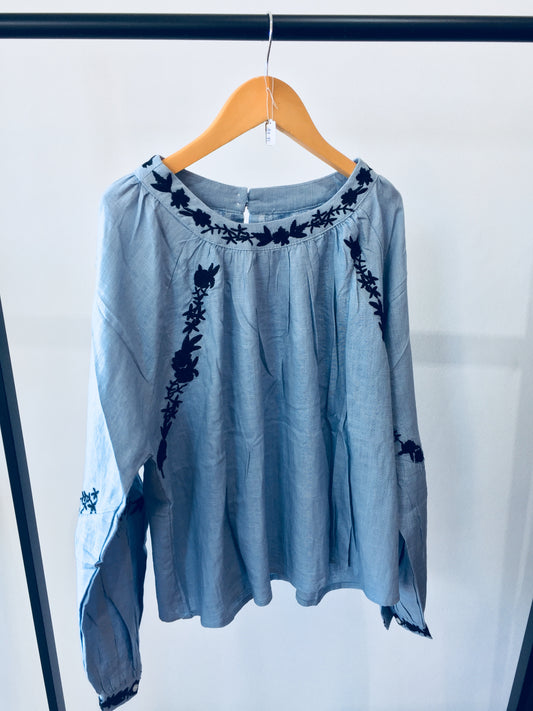 Light Wash Blue Linen Shirt With Black Floral Hand Embroidered Detail.