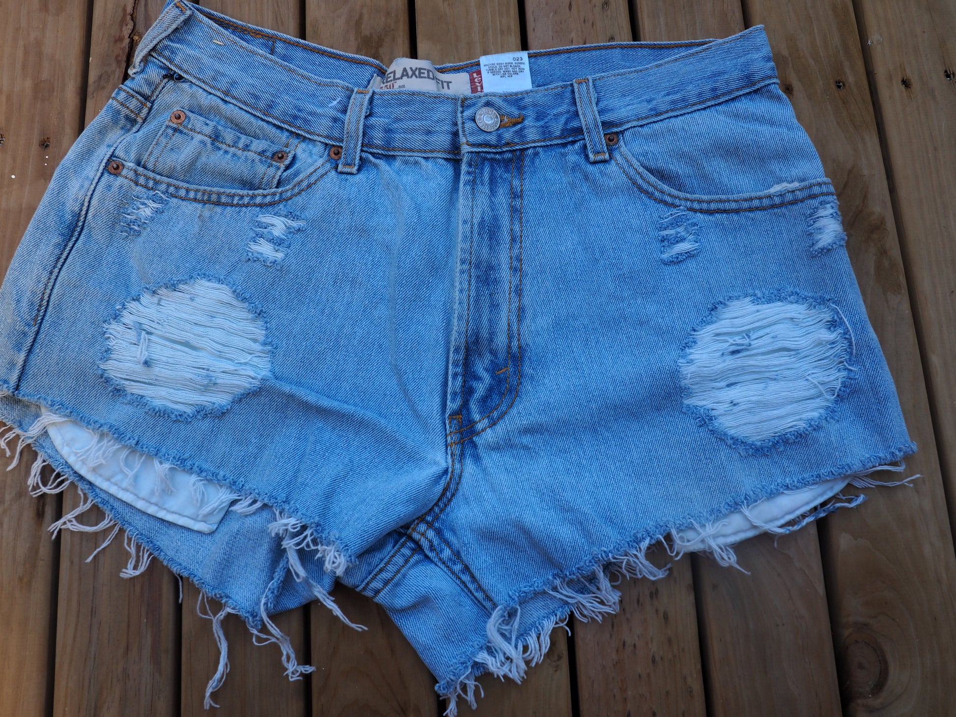 Vintage distressed Levis cut off shorts, loose fit for women