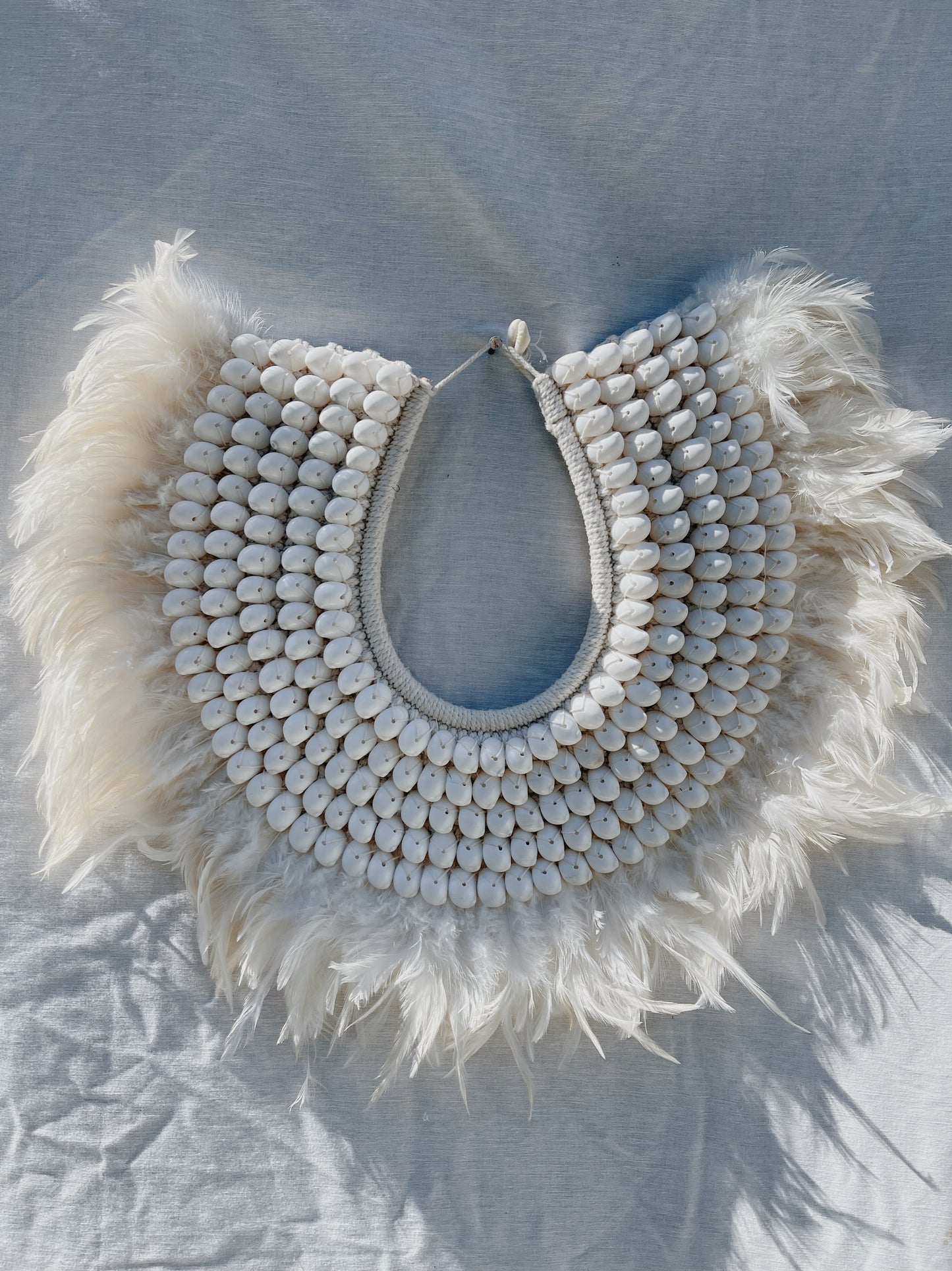 Shell, feather and macrame hand made tribal neckpiece made for display on a wall or side board, mixture of white and natural
