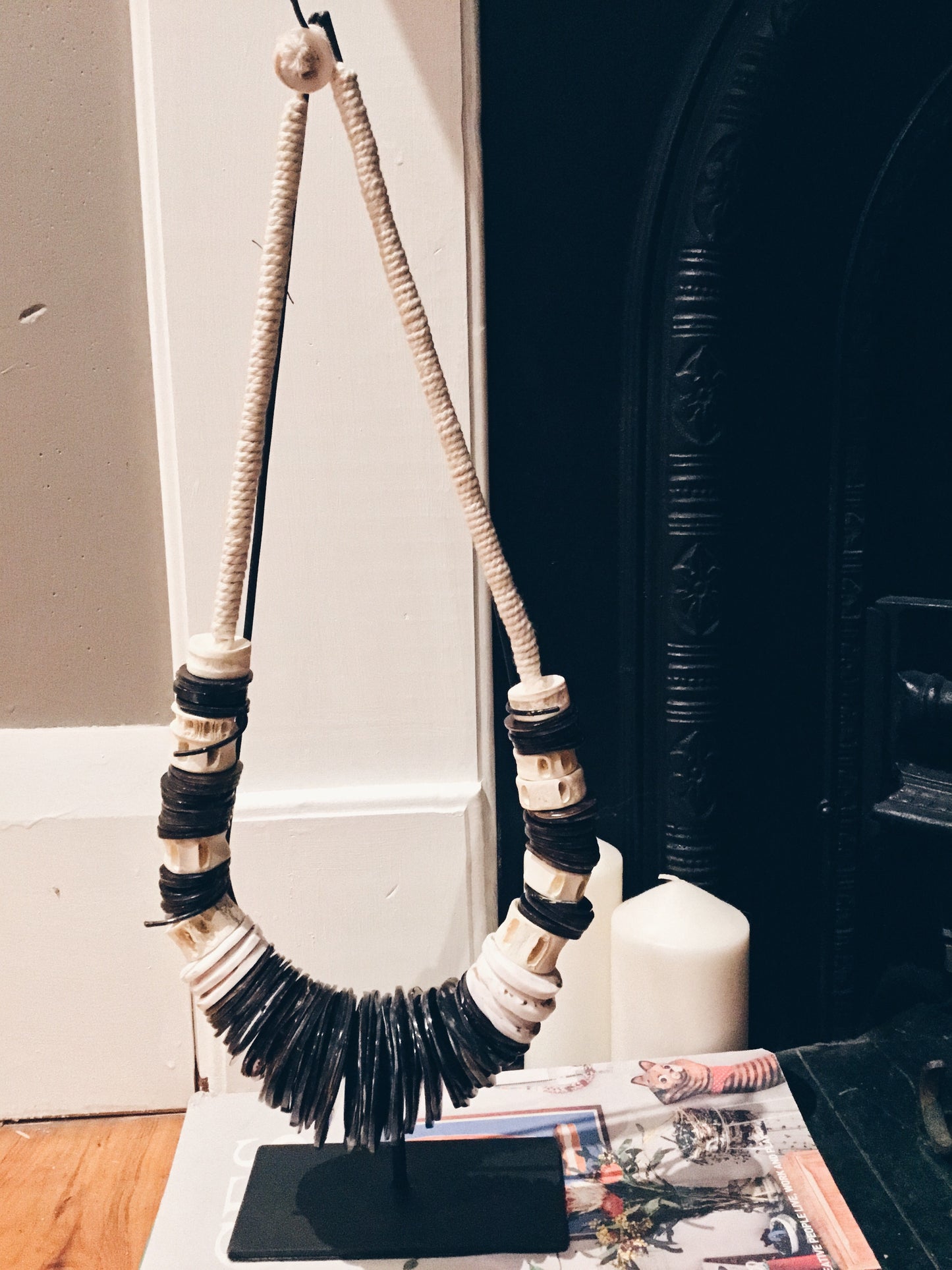 BLACK AND WHITE TRIBAL PEACE NECKLACE ON STAND